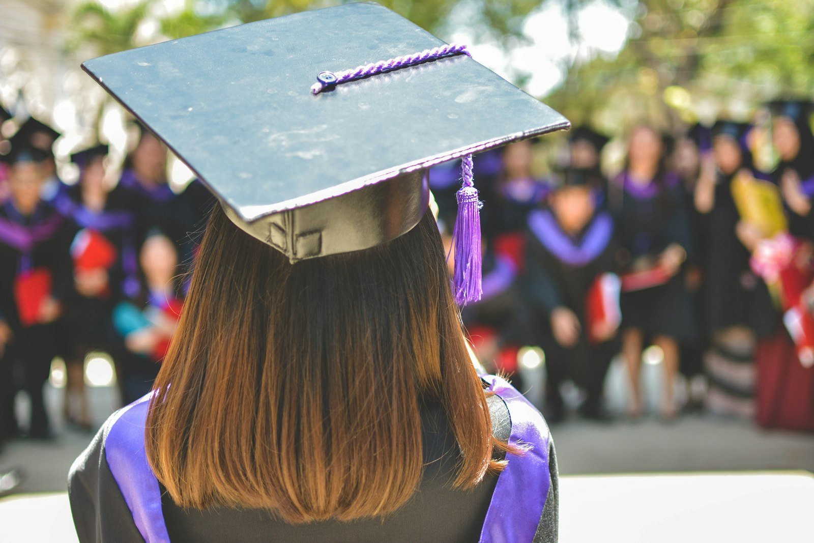 Graduates in academic dress at a ceremony